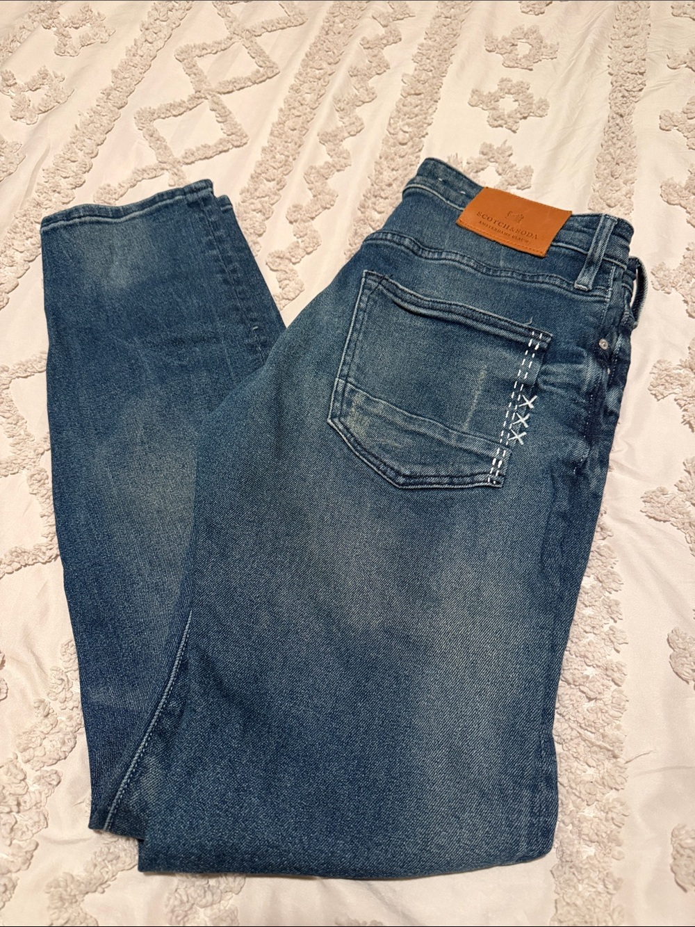 Scotch & Soda blue jeans with tan leather patch